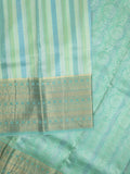 Kanchi kora pattu saree in lux green color allover zari stripes & zari border with rich pallu and plain blouse