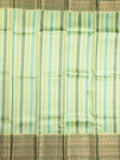 Kanchi kora pattu saree in light green color allover zari stripes & zari border with rich pallu and plain blouse