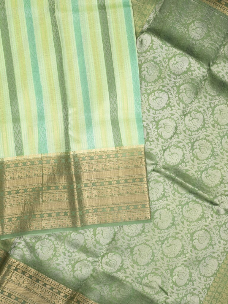 Kanchi kora pattu saree in light green color allover zari stripes & zari border with rich pallu and plain blouse
