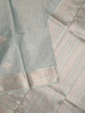 Fancy tissue saree in pastel blue color allover zari motifs & zari border with zari pallu and self blouse