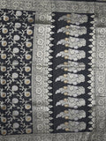 Banaras pattu saree in black color allover zari weaves & zari border with rich pallu and striped blouse