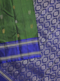 Kanchi pattu saree in bottle green color allover zari motifs & zari border with rich pallu and plain blouse