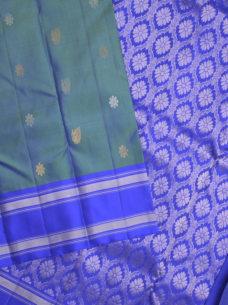 Kanchi pattu saree in peacock blue color allover zari motifs & zari border with rich pallu and plain blouse