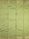 Dupion fancy saree light pista green color allover zari motifs & zari border with zari pallu and plain blouse