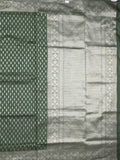 Dupion fancy saree bottle green color allover zari motifs & zari border with rich pallu and plain blouse