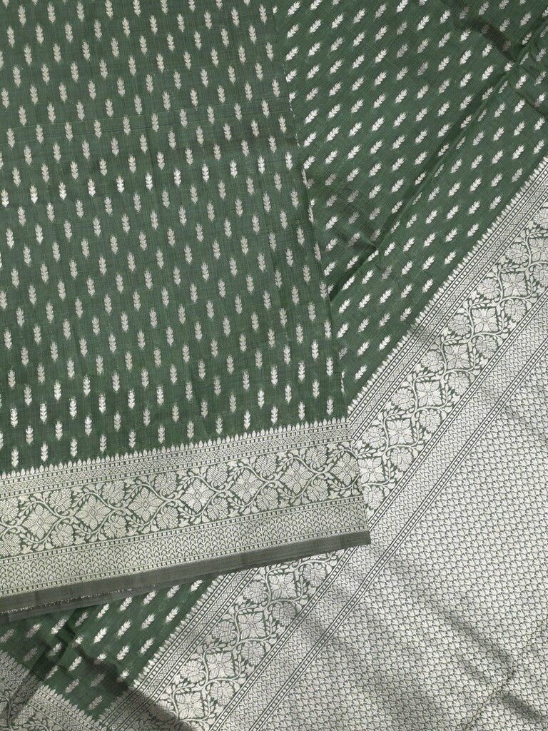 Dupion fancy saree bottle green color allover zari motifs & zari border with rich pallu and plain blouse
