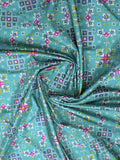 Crape fancy saree sky blue color allover prints & contrast border with printed pallu and attached plain blouse