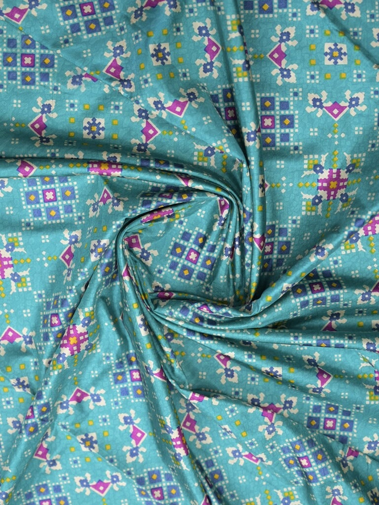 Crape fancy saree sky blue color allover prints & contrast border with printed pallu and attached plain blouse