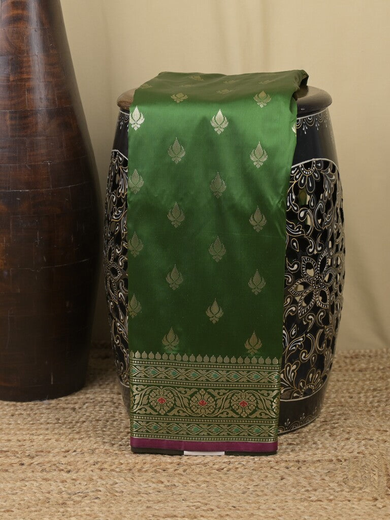 Banaras fancy saree bottle green color allover zari motifs & zari border with rich contrast pallu and plain blouse