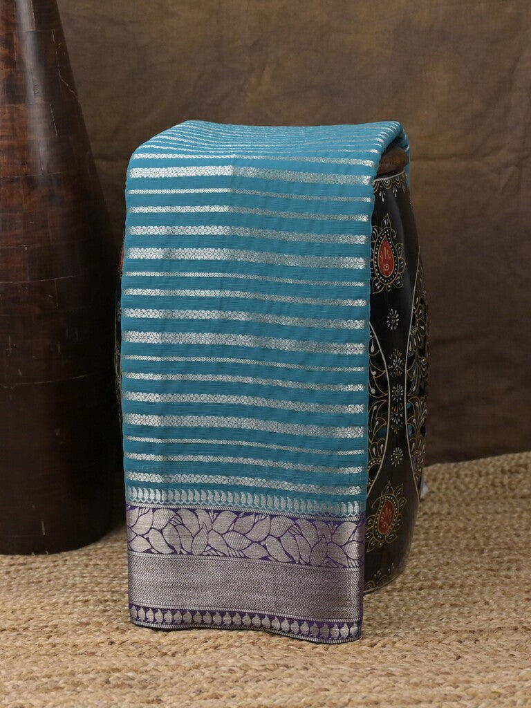 Georgette fancy saree sky blue color allover zari stripes & zari border with rich pallu and plain blouse