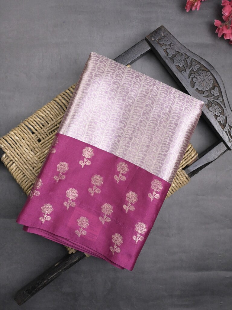 Tissue fancy saree pastel purple color allover weaves & contrast border with self pallu and attached blouse