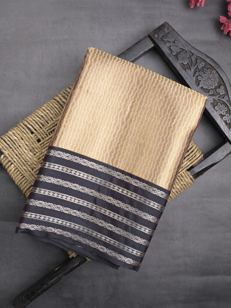 Tissue fancy saree cream color allover weaves & contrast border with self pallu and attached blouse