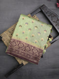 Banaras fancy saree light pista green color allover zari motifs & zari border with rich pallu and attached blouse