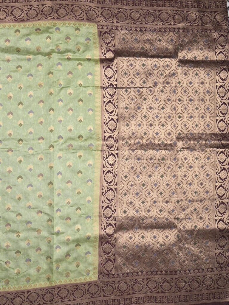 Banaras fancy saree light pista green color allover zari motifs & zari border with rich pallu and attached blouse