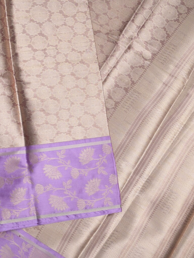 Tissue fancy saree light beige color allover weaves & contrast border with self pallu and attached blouse