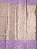 Tissue fancy saree light beige color allover weaves & contrast border with self pallu and attached blouse