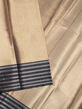 Tissue fancy saree cream color allover weaves & contrast border with self pallu and attached blouse