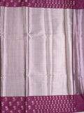 Tissue fancy saree pastel purple color allover weaves & contrast border with self pallu and attached blouse