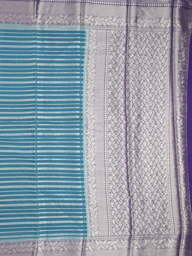 Georgette fancy saree sky blue color allover zari stripes & zari border with rich pallu and plain blouse