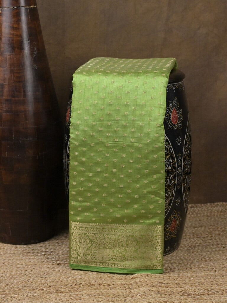 Dupion fancy saree parrot green color allover zari motifs & zari border with stripes pallu and running blouse