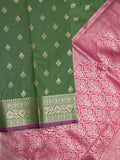 Banaras fancy saree bottle green color allover zari motifs & zari border with rich contrast pallu and plain blouse