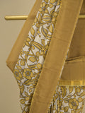 Kalamkari silk saree in cream, featuring a contrast color border and plain matching blouse
