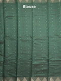Dupion fancy saree dark green color allover zari motifs & zari border with zari pallu and running blouse