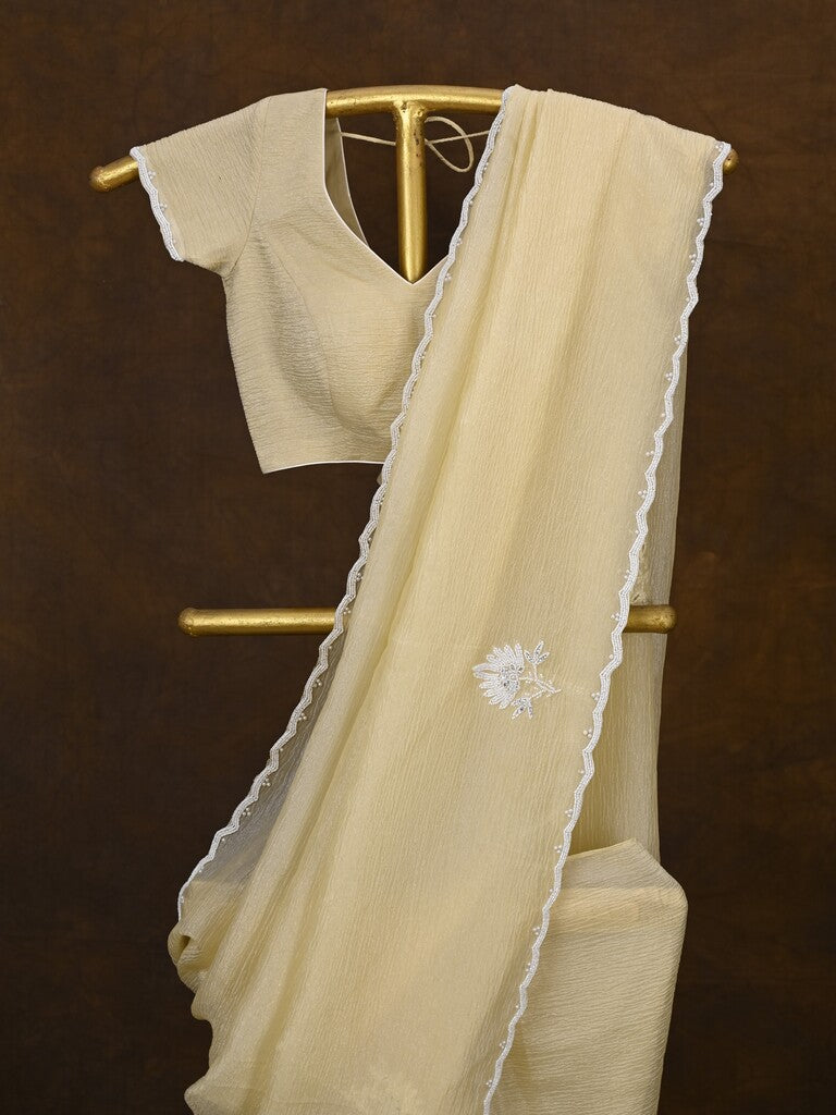 Crush organza fancy saree cream color allover embroidery motifs & embroidery border with running pallu and stitched blouse