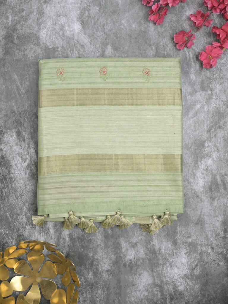Tussar fancy saree light pista green color allover prints & small kaddi border with printed pallu and attached plain blouse