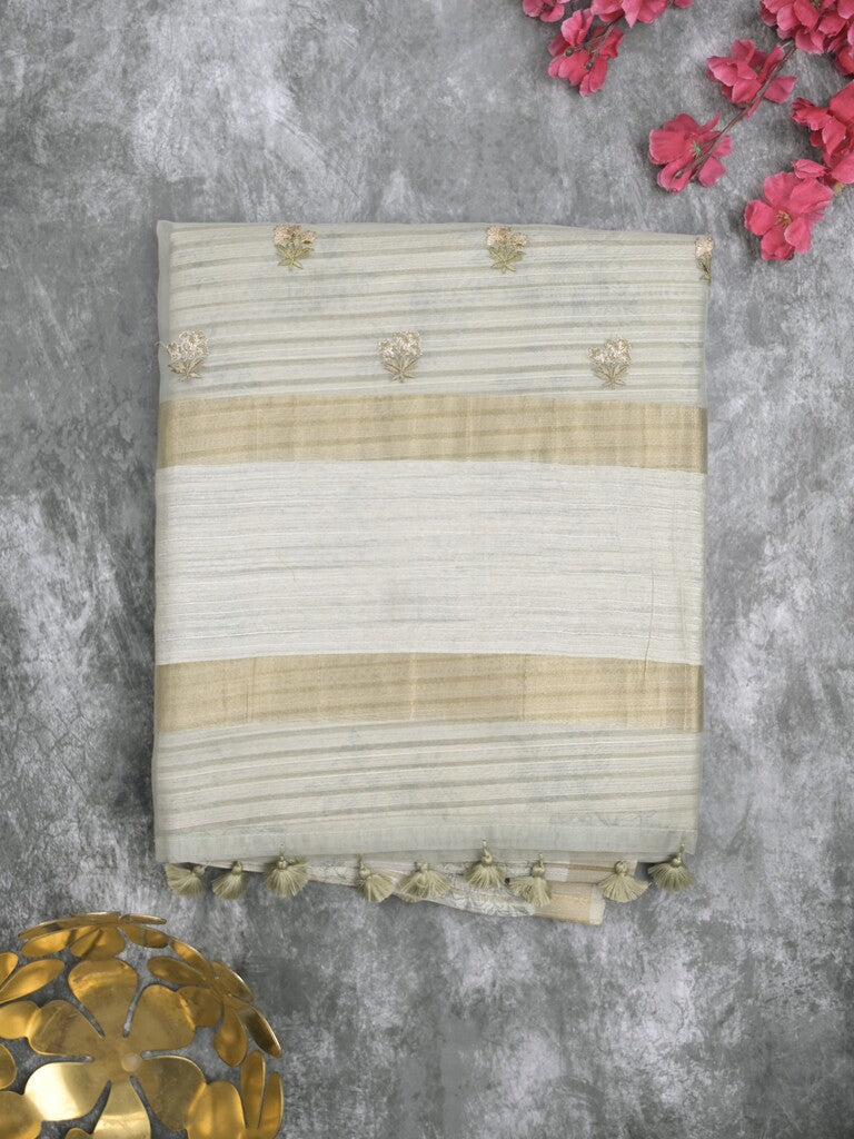 Tussar fancy saree light grey color allover prints & small kaddi border with printed pallu and attached plain blouse