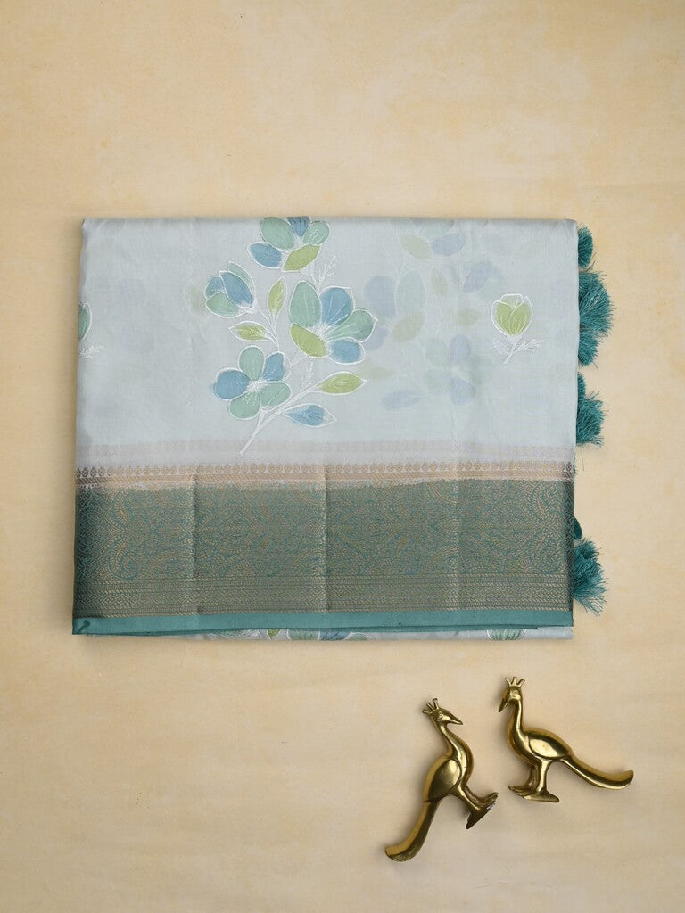 Mashru silk fancy saree pastel blue color allover prints & zari border with plain pallu and printed blouse