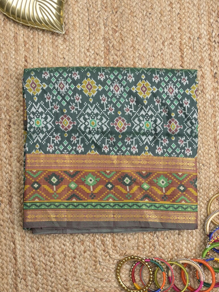 Ikkath fancy saree in dark green color allover design with zari border & ikkath pallu and plain blouse