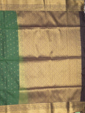 Kanchi pattu saree bottle green color allover zari motifs & zari border with rich pallu and contrast plain blouse