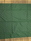 Kanchi pattu saree bottle green color allover zari motifs & zari border with rich pallu and contrast plain blouse