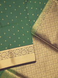 Kanchi pattu saree bottle green color allover zari motifs & zari border with rich pallu and contrast plain blouse