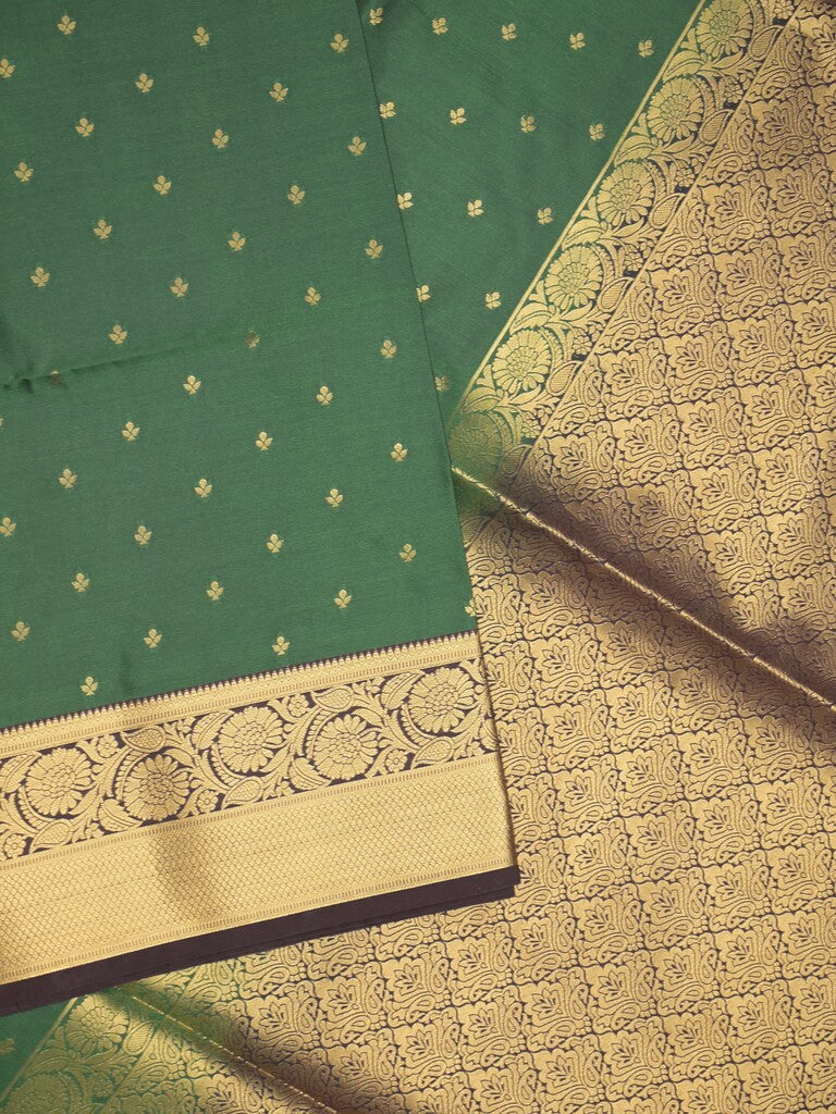 Kanchi pattu saree bottle green color allover zari motifs & zari border with rich pallu and contrast plain blouse