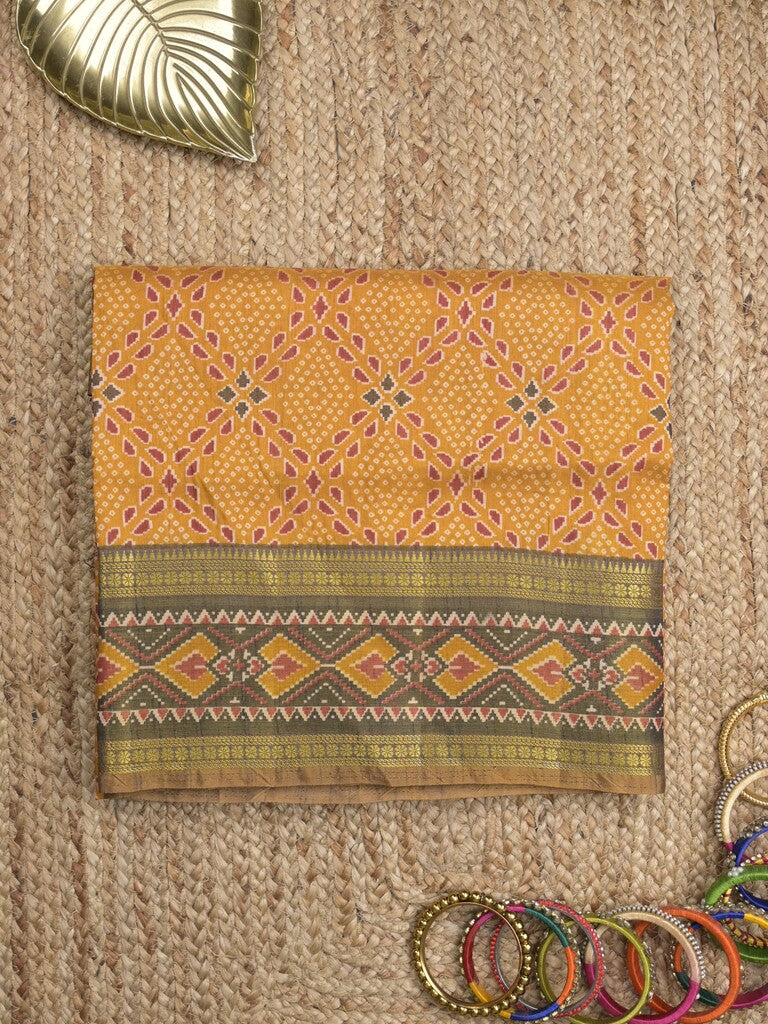 Ikkath fancy saree in golden yellow color allover design with zari border & ikkath pallu and plain blouse