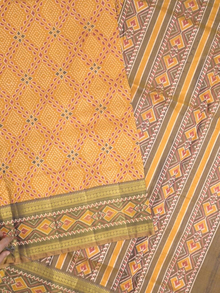 Ikkath fancy saree in golden yellow color allover design with zari border & ikkath pallu and plain blouse