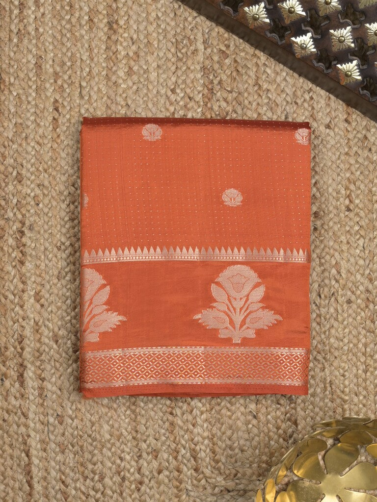 Dupion fancy saree in orange color allover zari motifs & zari border with zari pallu and attached blouse