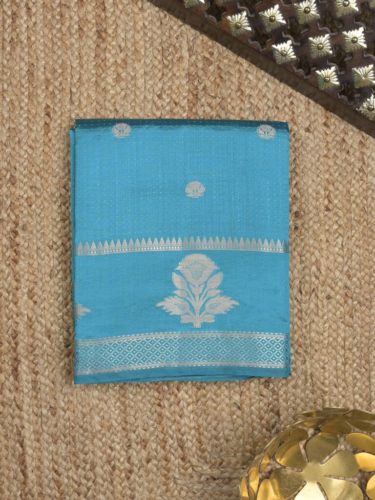Dupion fancy saree in sky blue color allover zari motifs & zari border with zari pallu and attached blouse