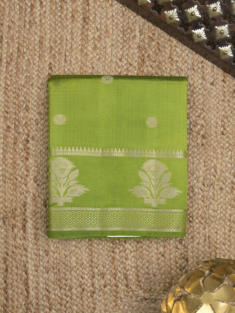 Dupion fancy saree in parrot green color allover zari motifs & zari border with zari pallu and attached blouse