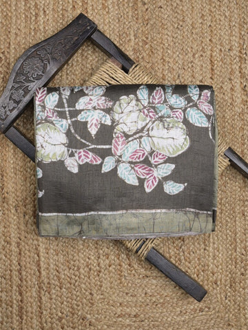 Jute tussar fancy saree in black and olive green color allover prints with printed pallu and attached blouse