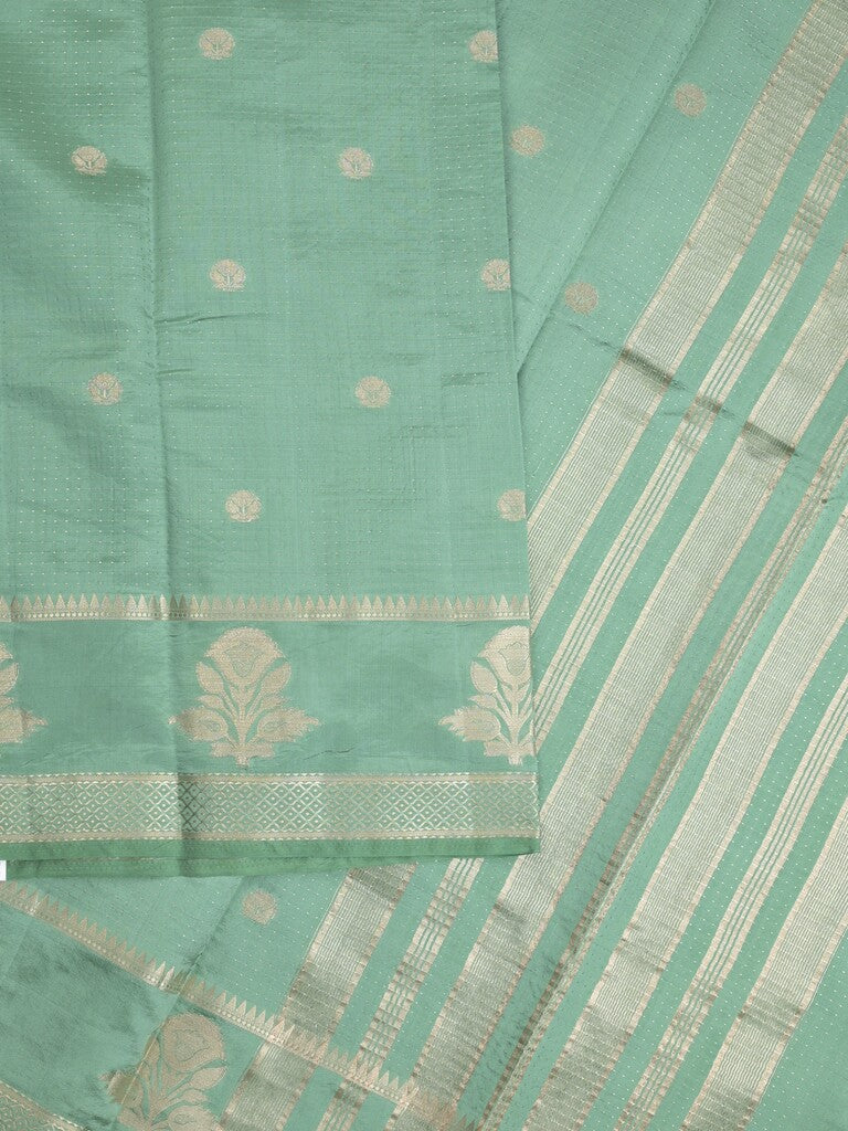 Dupion fancy saree in lux green color allover zari motifs & zari border with zari pallu and attached blouse