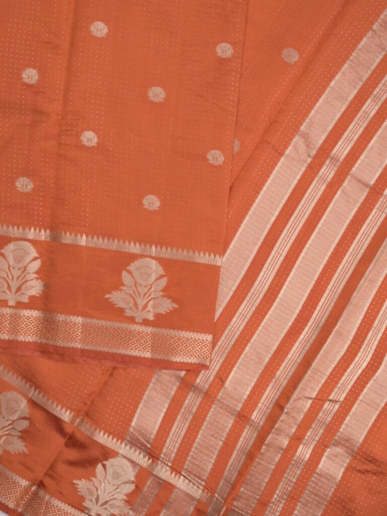 Dupion fancy saree in orange color allover zari motifs & zari border with zari pallu and attached blouse