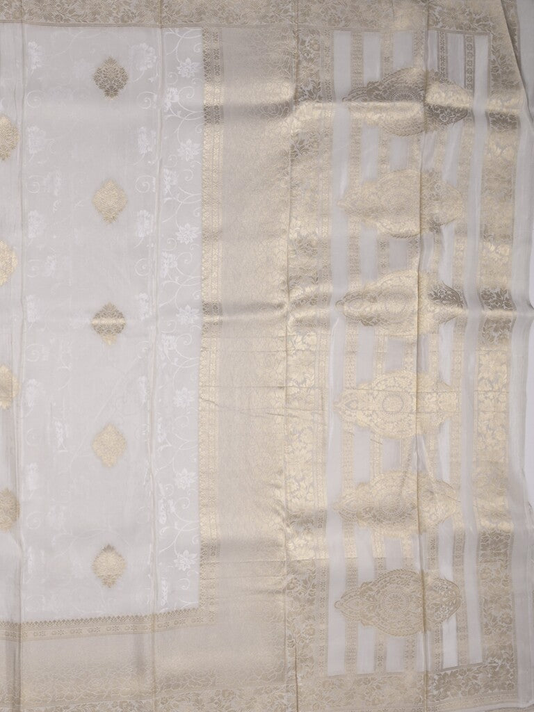 Dola tissue fancy saree white color allover zari motifs & zari border with rich pallu and plain self blouse