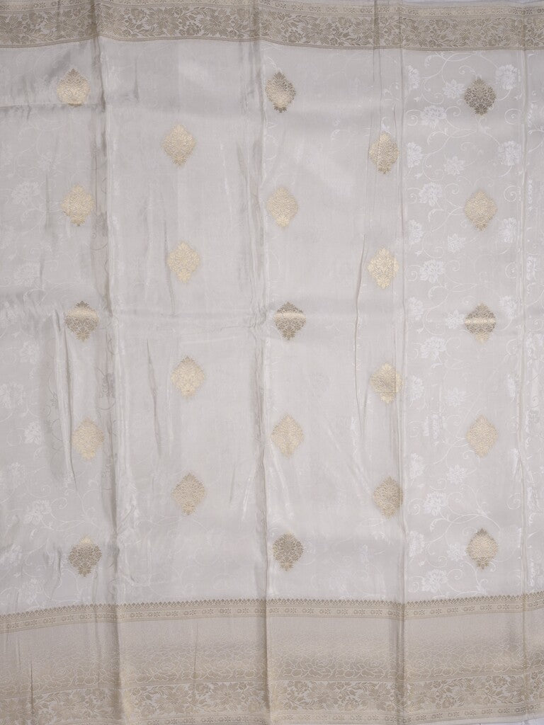 Dola tissue fancy saree white color allover zari motifs & zari border with rich pallu and plain self blouse