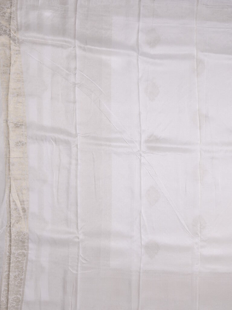 Dola tissue fancy saree white color allover zari motifs & zari border with rich pallu and plain self blouse
