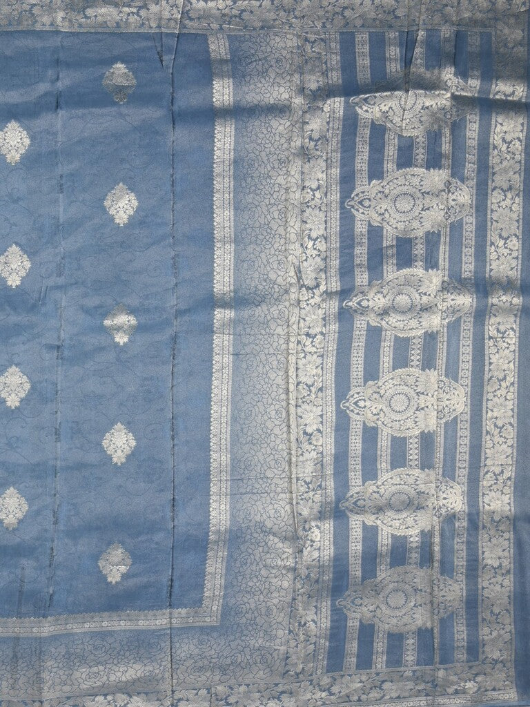 Dola tissue fancy saree light blue color allover zari motifs & zari border with rich pallu and plain self blouse