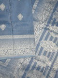 Dola tissue fancy saree light blue color allover zari motifs & zari border with rich pallu and plain self blouse