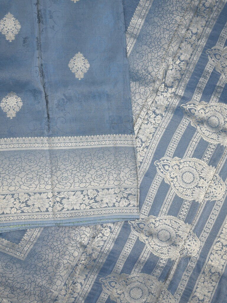 Dola tissue fancy saree light blue color allover zari motifs & zari border with rich pallu and plain self blouse